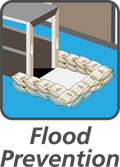 Floodwater against a residential doorway, illustrating the kind of rainfall flooding NOAA's El Nino winter outlook favors