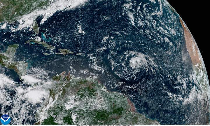 GOES-19 satellite view of the tropical Atlantic on August 28, 2026, showing a sheared remnant swirl and no organized tropical storms